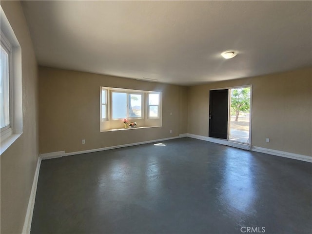 unfurnished room featuring a wealth of natural light