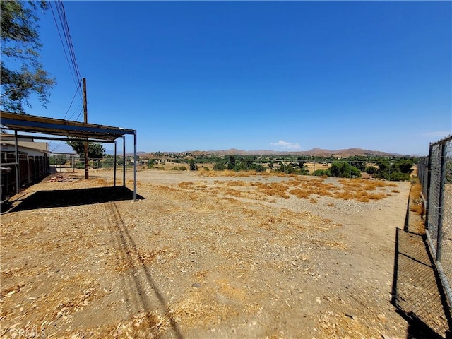 view of yard featuring a mountain view and a rural view