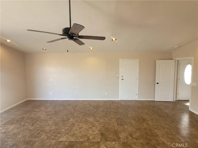 spare room with ceiling fan