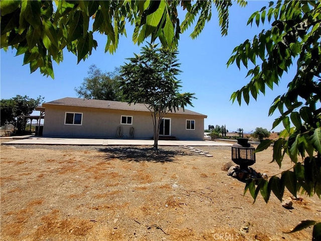 back of property featuring a patio area