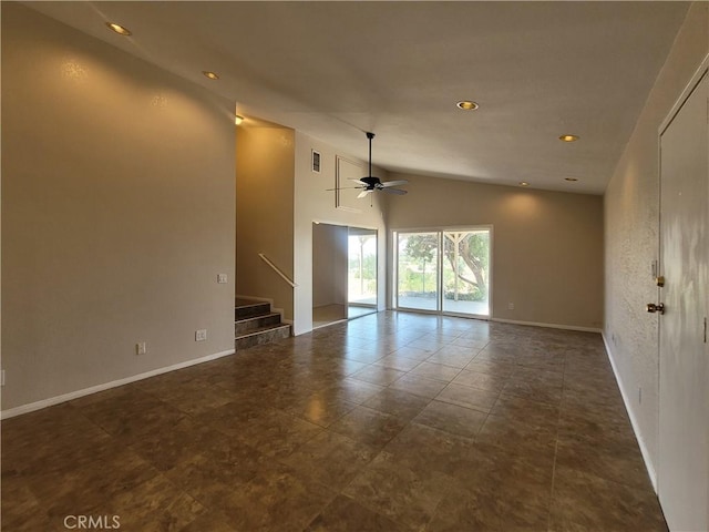 unfurnished room with ceiling fan and high vaulted ceiling