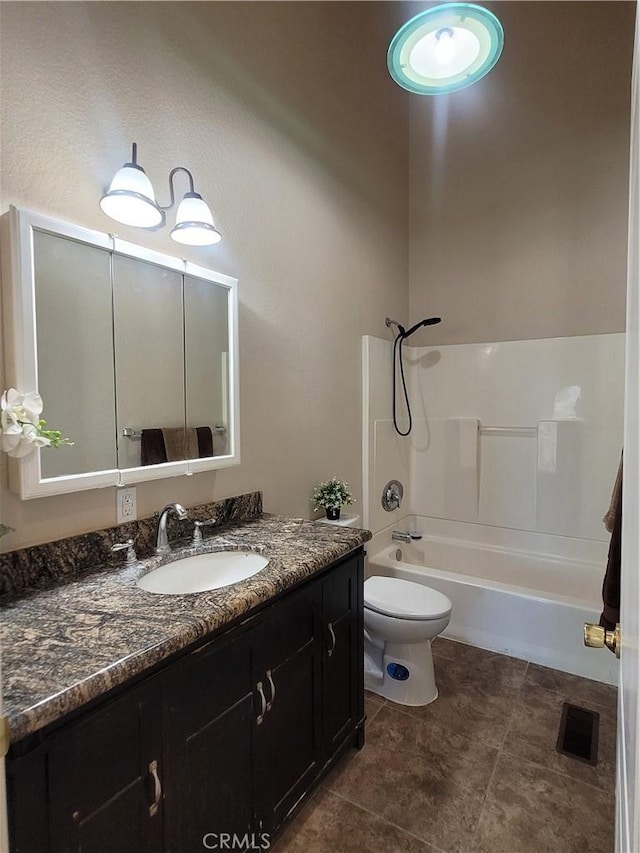 full bathroom featuring tile patterned floors, vanity, toilet, and bathing tub / shower combination