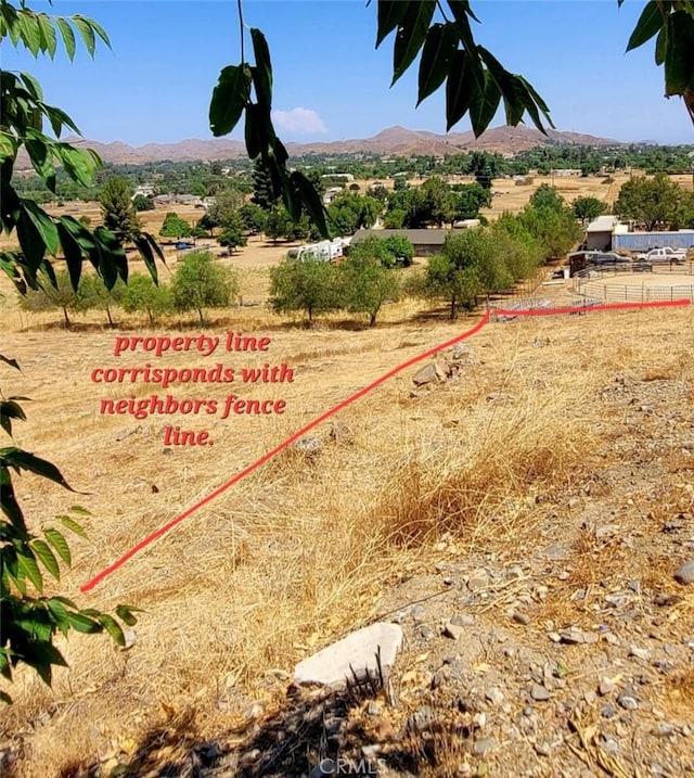 property view of mountains featuring a rural view