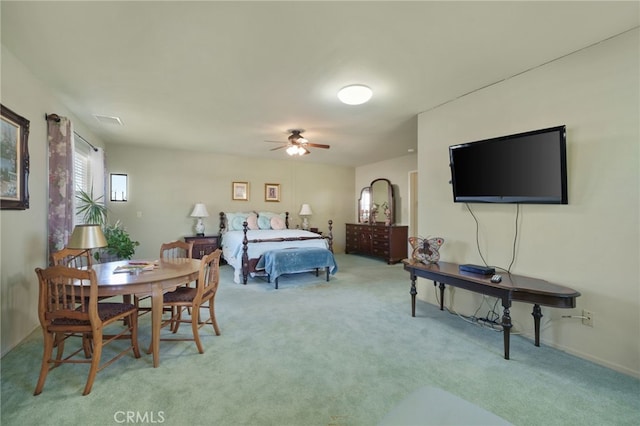 bedroom featuring ceiling fan and light carpet