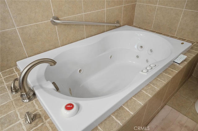 bathroom featuring a relaxing tiled tub