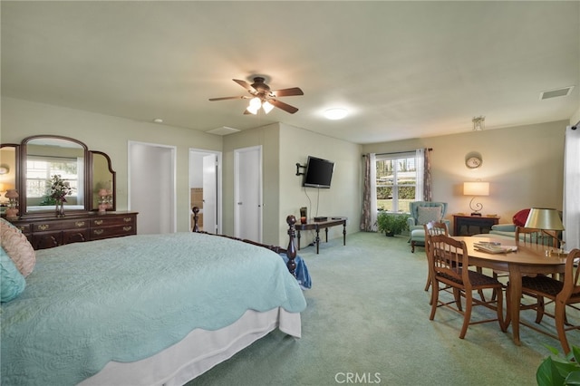 bedroom with light carpet and ceiling fan