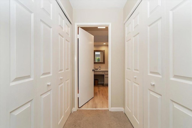 corridor with light colored carpet