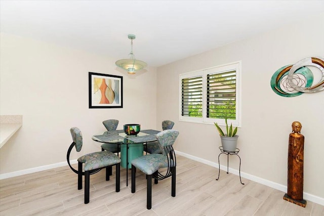 dining area featuring light wood-type flooring