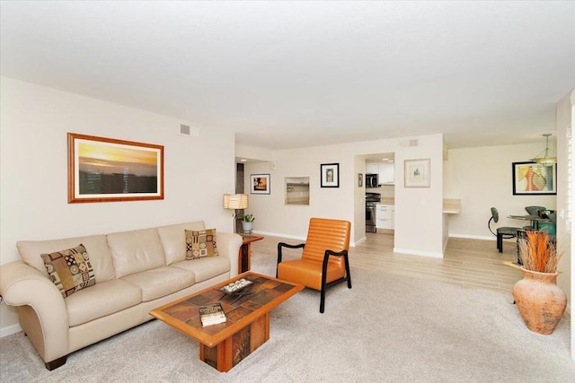 living room with light hardwood / wood-style floors