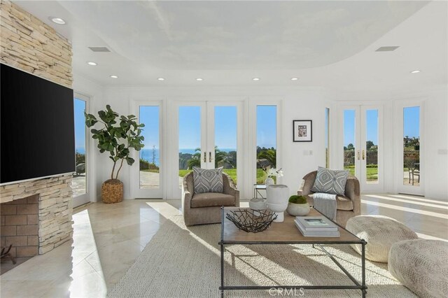 19 Marguerite Dr, Rancho Palos Verdes, CA 90275 - living room with french doors, healthy amount of natural light, recessed lighting, and a fireplace