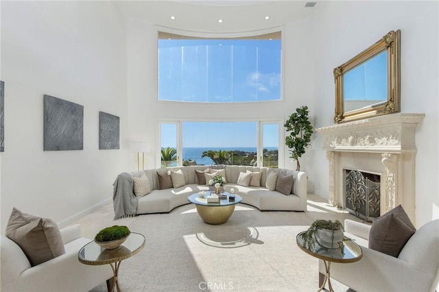 19 Marguerite Dr, Rancho Palos Verdes, CA 90275 - carpeted living area featuring a high ceiling, a high end fireplace, baseboards, and recessed lighting