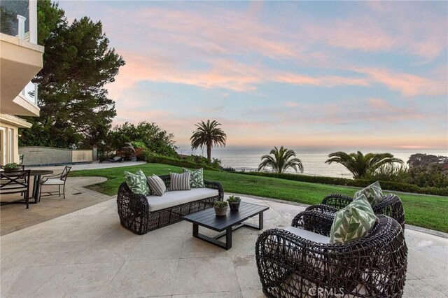 19 Marguerite Dr, Rancho Palos Verdes, CA 90275 - patio terrace at dusk featuring a water view, a yard, and an outdoor hangout area