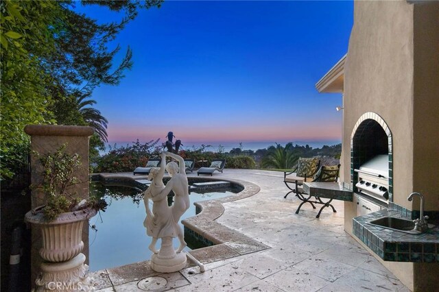 19 Marguerite Dr, Rancho Palos Verdes, CA 90275 - patio terrace at dusk with a sink, an outdoor pool, and a grill