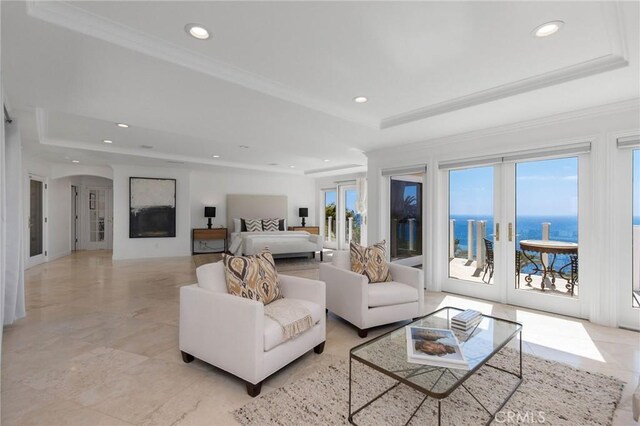 19 Marguerite Dr, Rancho Palos Verdes, CA 90275 - living room featuring a raised ceiling, recessed lighting, arched walkways, crown molding, and a water view