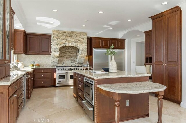 19 Marguerite Dr, Rancho Palos Verdes, CA 90275 - kitchen featuring built in appliances, tasteful backsplash, crown molding, light stone counters, and recessed lighting