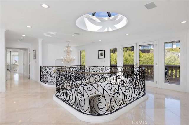19 Marguerite Dr, Rancho Palos Verdes, CA 90275 - hallway featuring recessed lighting, marble tiled flooring, a chandelier, and an upstairs landing