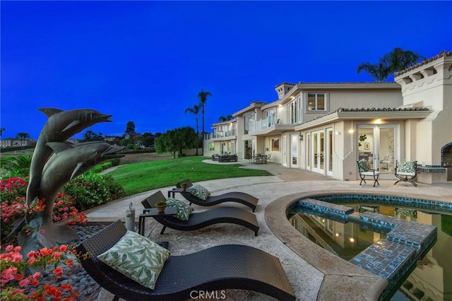 exterior space featuring a patio and a lawn