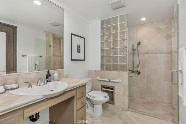 19 Marguerite Dr, Rancho Palos Verdes, CA 90275 - full bathroom featuring tile walls, a stall shower, toilet, ornamental molding, and vanity