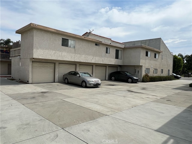 view of side of home with a garage