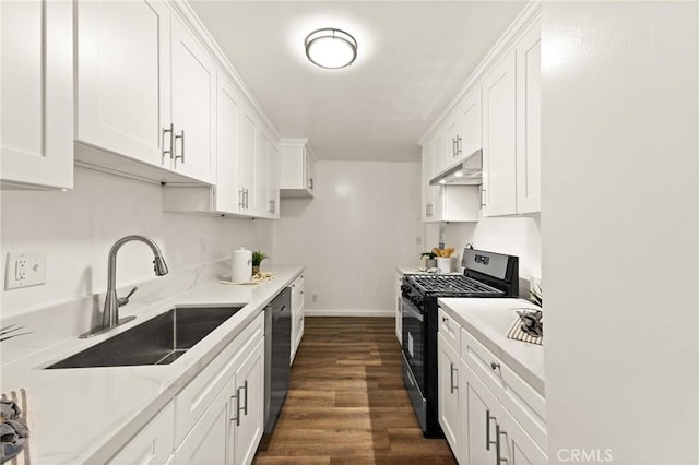 kitchen featuring dark wood-type flooring, sink, white cabinets, and stainless steel appliances