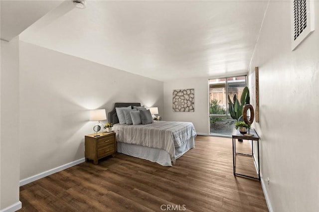 bedroom featuring dark hardwood / wood-style floors