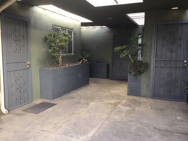 doorway to property featuring a patio