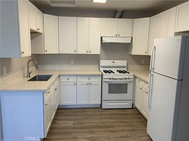 kitchen featuring white appliances, dark wood-style floors, white cabinetry, under cabinet range hood, and a sink