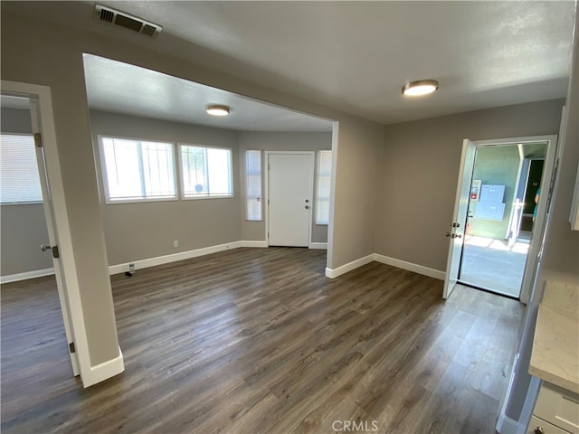 foyer with dark hardwood / wood-style floors