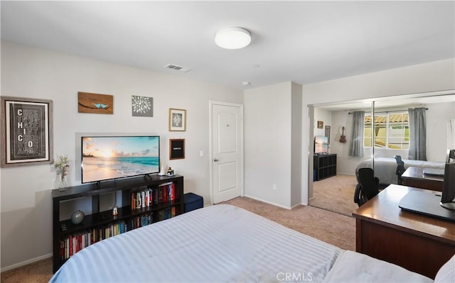 carpeted bedroom featuring a closet