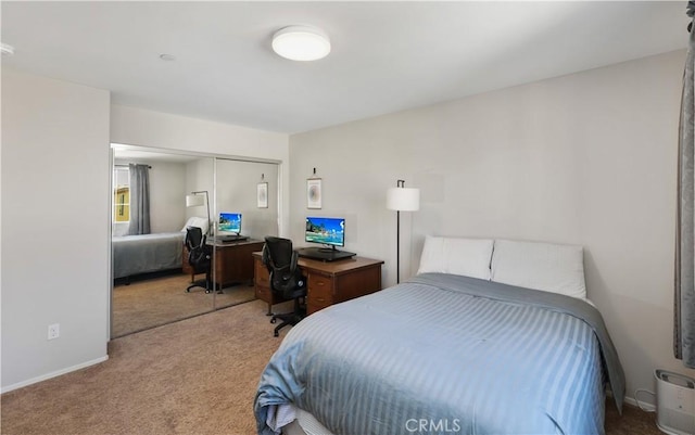 bedroom featuring a closet and carpet