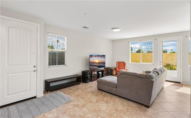 living room with light tile patterned floors