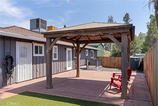 view of patio with a gazebo and central air condition unit