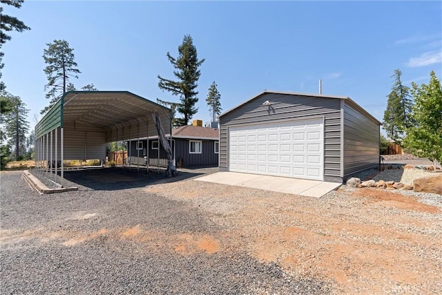 garage featuring a carport