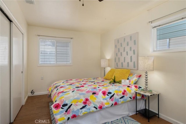 bedroom with hardwood / wood-style flooring and a closet