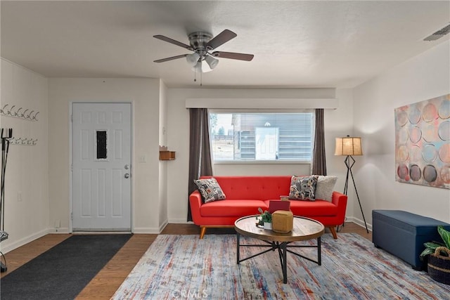 living room featuring hardwood / wood-style flooring and ceiling fan