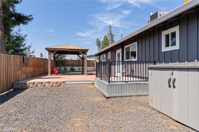 view of yard featuring a gazebo, cooling unit, and a patio