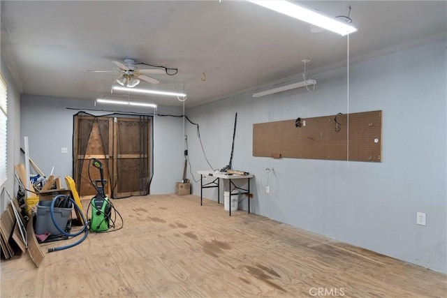 basement with hardwood / wood-style floors and ceiling fan