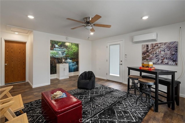 living room featuring ceiling fan, dark wood-type flooring, and a wall unit AC