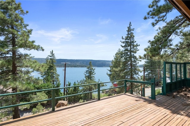 wooden deck with a water view