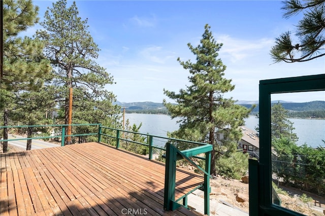 deck featuring a water and mountain view