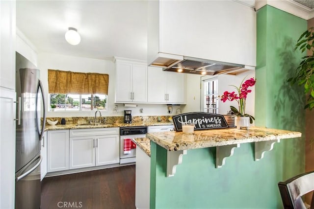 kitchen featuring white cabinetry, stainless steel fridge, white dishwasher, and light stone counters