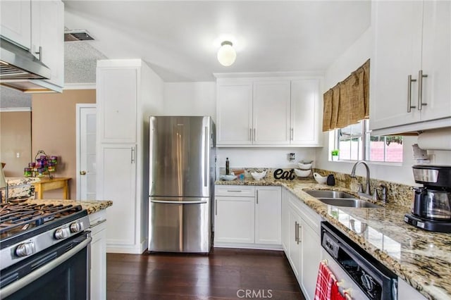 kitchen featuring white cabinetry, sink, dark wood-type flooring, and appliances with stainless steel finishes