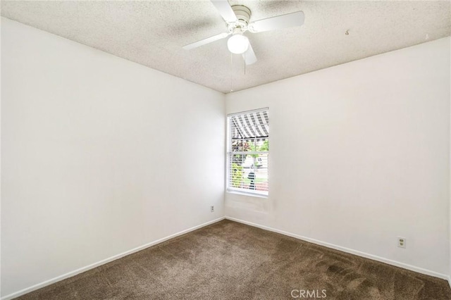 carpeted spare room with ceiling fan and a textured ceiling