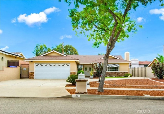 single story home with a garage