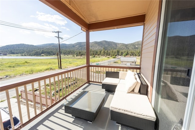 balcony featuring a mountain view