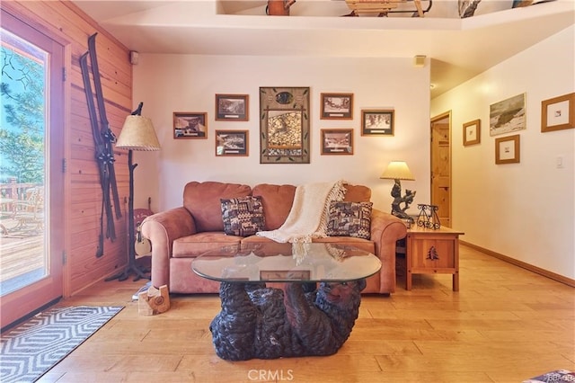 living room with light wood-style flooring and baseboards