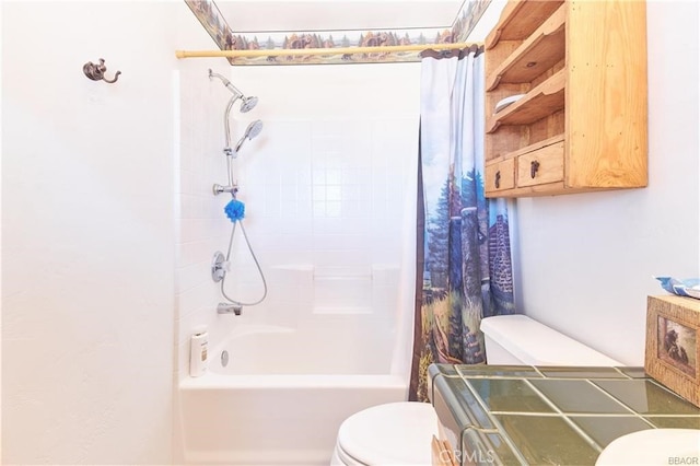 full bathroom featuring shower / bath combination with curtain and toilet