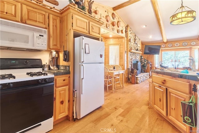 kitchen with vaulted ceiling with beams, light wood-style flooring, white appliances, hanging light fixtures, and tile counters