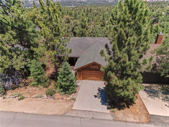 aerial view featuring a wooded view