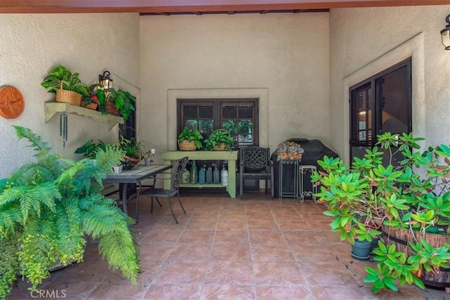 property entrance featuring a patio area